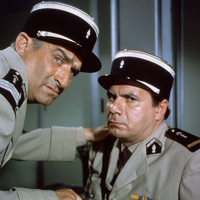 Četník v New Yorku (1965), na snímku s ním velitel Michel Galabru. Velitel: „Cruchote! Jsem krajně nespokojen! Italové jsou už kompletní a vysmívají se nám! Já mám jednu absenci a dva šašky!"